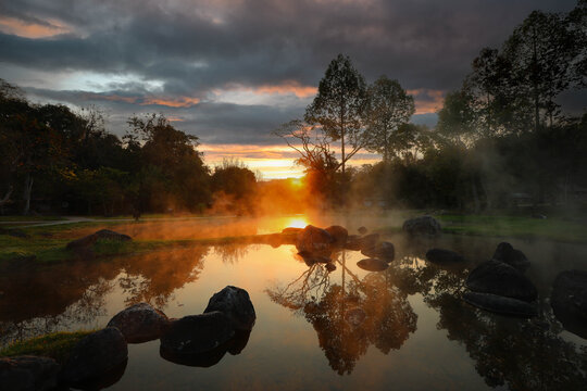 Morning fog on hot spring with the environment and tropical rainforest