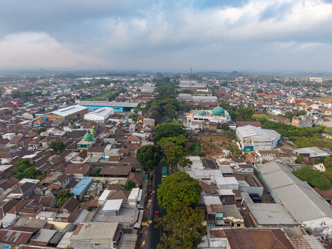 Overcast sky looms above sprawling urban sprawl at PT. Pertamina Fuel Terminal Malang