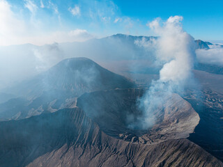 Smoke drifts from a volcanic crater edge at Mount Bromo © Cloudyew