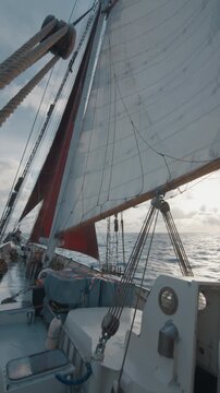Big expeditional sailing boat sails in the ocean under the sails