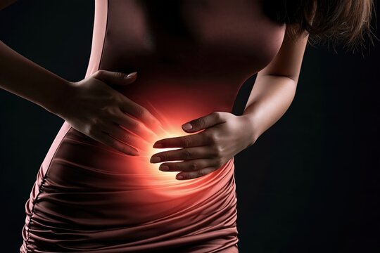 Woman holding her painful stomach with glowing red abdominal pain area