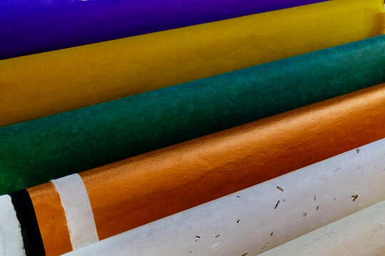 Rolls of colorful handmade paper close-up