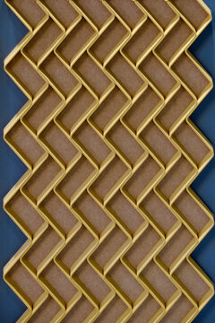 Gold wood chevron weave pattern on teal background