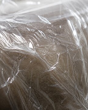 Close-up of clear cellophane plastic wrap food packaging texture