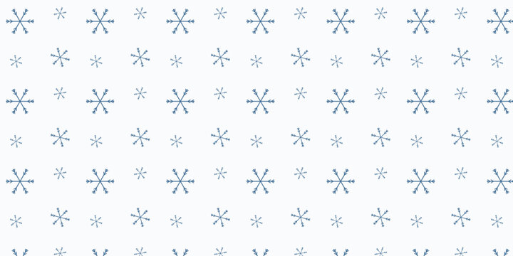 Minimalist blue snowflake pattern on a white background