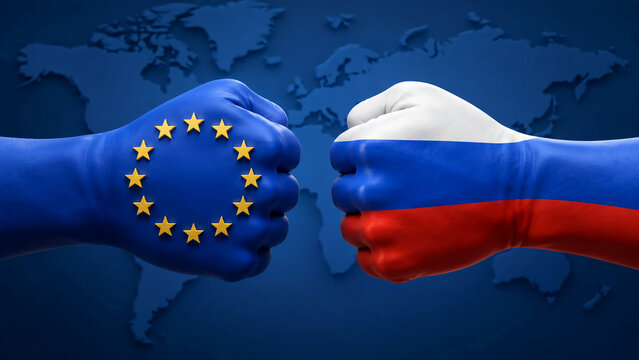 eTwo fists painted with the European Union and Russian flags facing off in front of a blue world map, representing international conflict and sanctions.