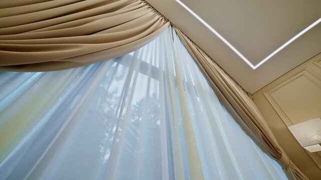 Sheer white window curtains with beige drapes in room