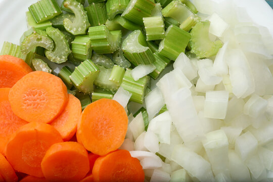 Fresh celery, carrots and onions as background, above view