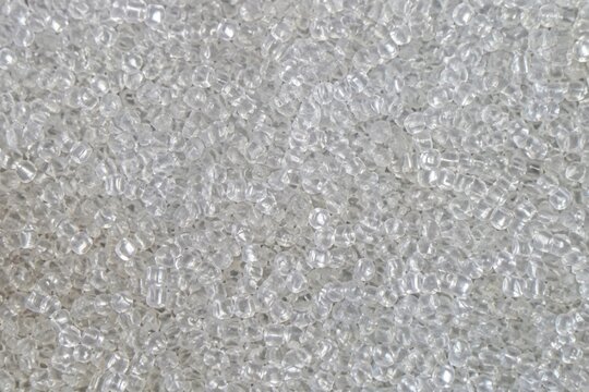 Clear polymer plastic pellets texture background