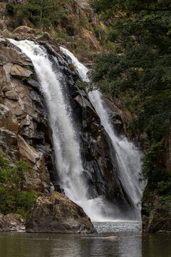 Mantenga Falls Cascading Over Rocky Cliff into Pool at Mantenga Nature Reserve Eswatini
