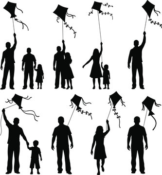 Silhouettes of families and children flying kites on a white background