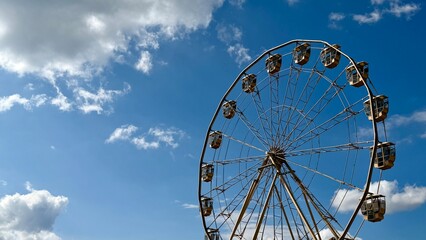 ferris wheel against blue sky © valentina fridman