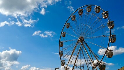ferris wheel against blue sky © valentina fridman