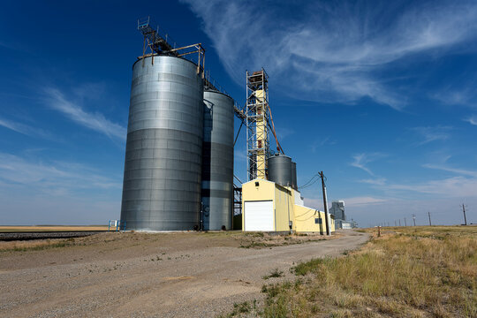 Grain elevator scenic against blue sky and distant horizon