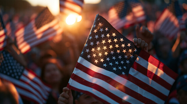 Crowd Waving American Flags During Patriotic Sunset Rally