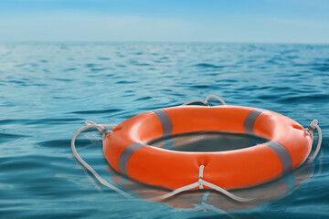 Bright lifebuoy floating on sea. Rescue gear © New Africa