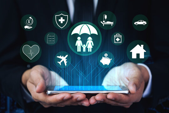 Businessman with Mobile Device Showcasing Digital Insurance Icons for Health, Finance, Travel, and Home Protection in Modern Technology Concept Haptic.