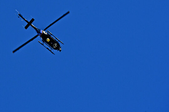 View up at TV News helicopter with nose and belly high-definition cameras