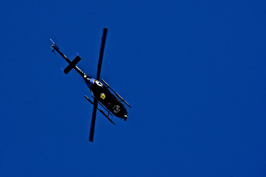 TV News helicopter circling overhead with two high definition cameras 