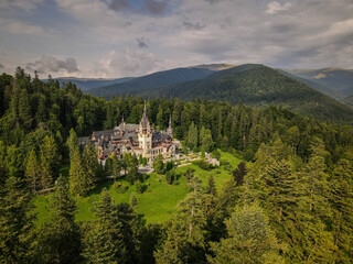 Peles Castle Aerial View Amidst Carpathian Mountains Forests in Sinaia, Romania © Greggory Zzyzx