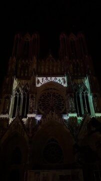 The light show Regalia on the facade of Reims Cathedral Notre-Dame de Reims. Reims, France, December 25, 2025. High quality 4k footage