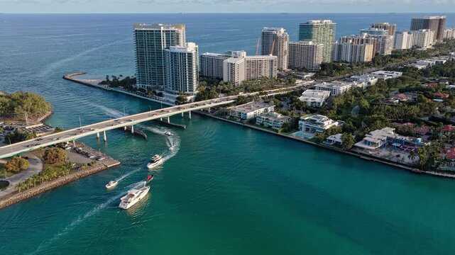 Yacht at sea. Aerial view on luxury charter yacht. Landscape aerial with Miami skyscraper. Luxury skyscraper in Miami south beach. Motorboat at sea. Landscape of Miami south beach. Marine transport