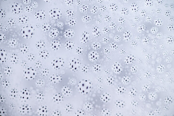 Close up of Black and White Abstract Water Drops on Glass Background © Anna Hoychuk