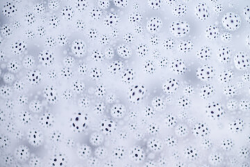 Close up of Black and White Abstract Water Drops on Glass Background © Anna Hoychuk