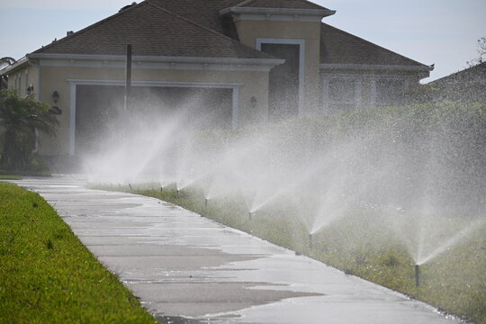 Automated Sprinkler System Watering Driveway