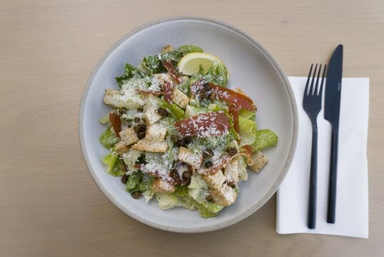 Caesar salad with croutons and capers