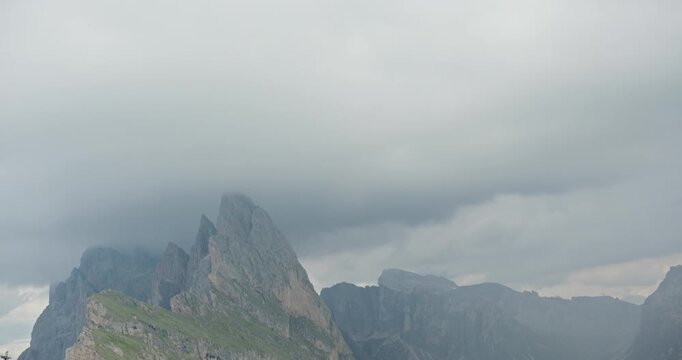 Storm clouds moving over Seceda mountain in the Dolomites