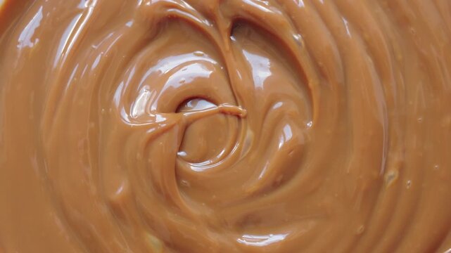 Rotating dulce de leche background. Horizontal format.