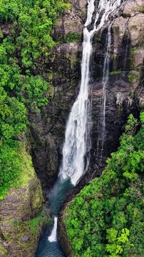 Cinematic aerial drone footage of Shangliar Falls, a stunning multi-tiered cascading waterfall located in Meghalaya, Northeast India, near the Sylhet border of Bangladesh.