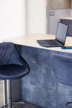 Laptop on kitchen island for remote work