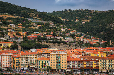 Fototapeta premium Colorful Mediterranean houses along Roya river in old town Ventimiglia, Italy