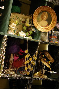 vintage shop display shelf of cubbyholes full of secondhand items