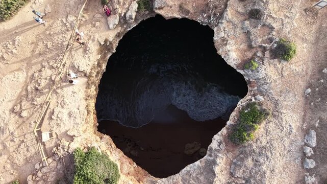 Aerial drone flying inside benagil cave in algarve portugal