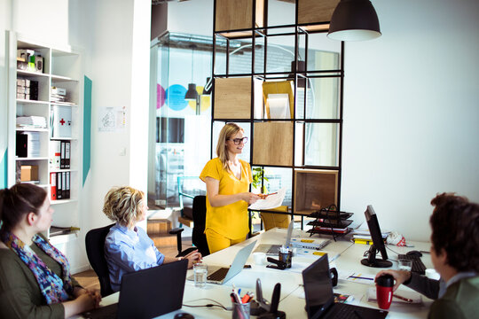 Woman leading team meeting in modern office