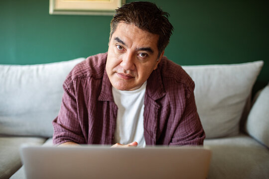 Mature man on video call at home