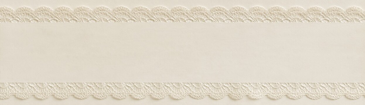 Cream paper background with delicate lace borders and copy space