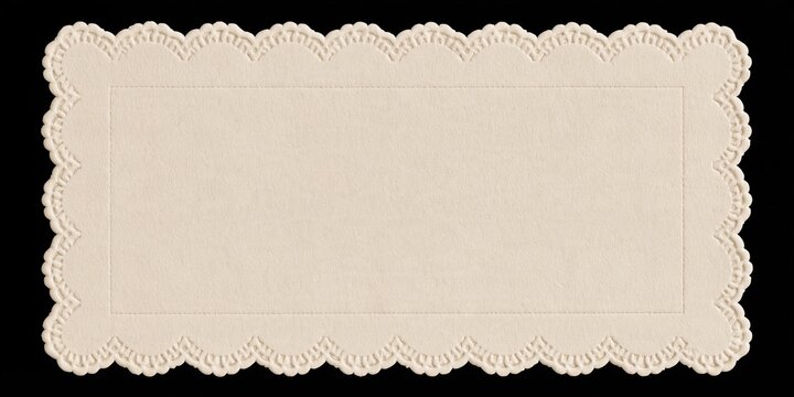 Cream rectangular lace doily with scalloped border on black