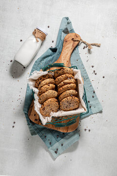 A basket of homemade quinoa chocolate chip cookies served with milk.
