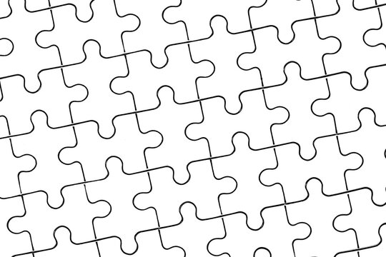 jigsaw puzzle. back side. white pieces forming flawless pattern