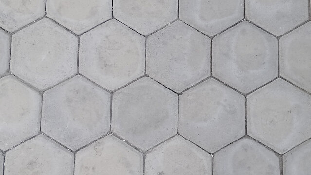 gray hexagonal concrete paving blocks pattern top view, pavement texture background