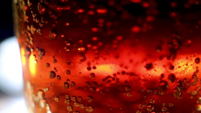 Macro view of carbonated bubbles in amber liquid