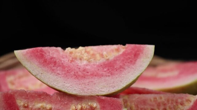 Fresh red-fleshed guavas in a basket	