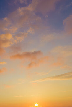 Sunrise northern sky and sun over distant horizon