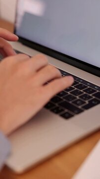 Hands Typing on Laptop While Working Remotely at Modern Home Office