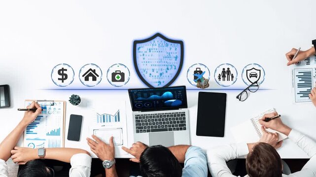 Collaborative Cybersecurity Strategy Session with Team Analyzing Digital Protection Icons and Financial Data in Modern Office Environment. Entropy.