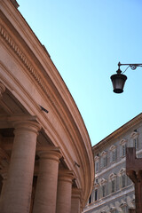 monumental classical architecture with massive stone columns, rounded capitals, and a heavy decorative cornice. A historic building with ornate window surrounds © SnapSD809